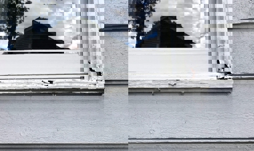 window with peeling paint.