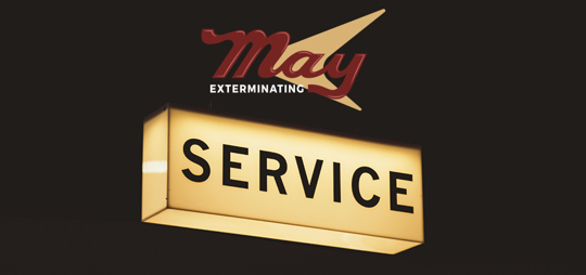 May Exterminating company logo and a sign says "SERVICE"