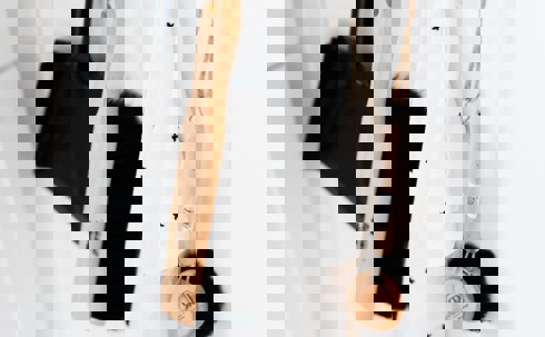 A black dustpan and brush