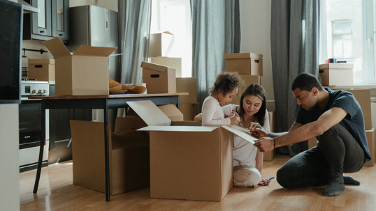 family with moving boxes