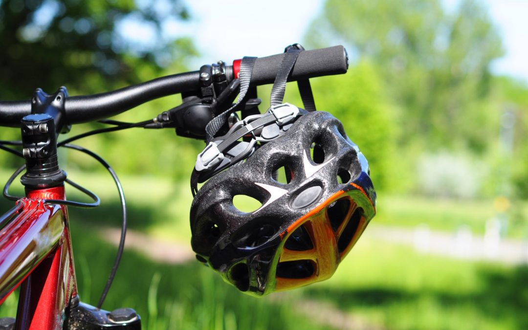 bike helmet dangling off bike handle