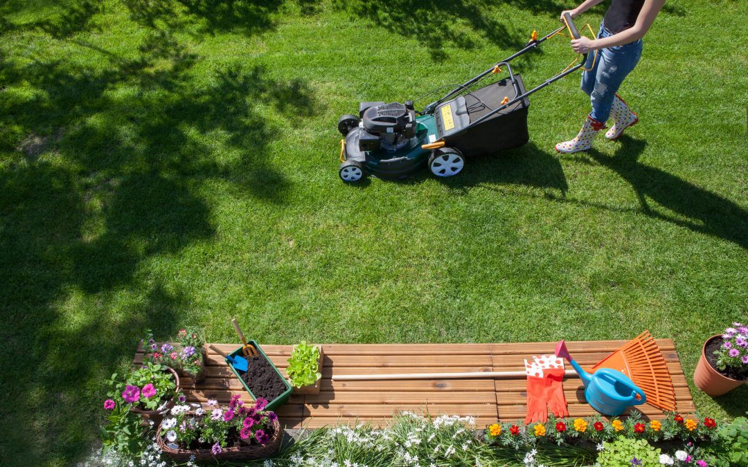 woman mowing lawn