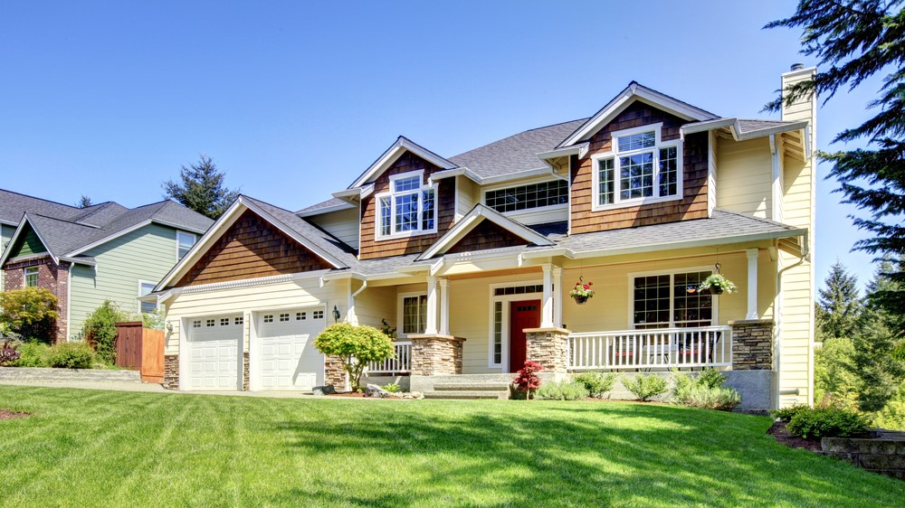 house with green lawn